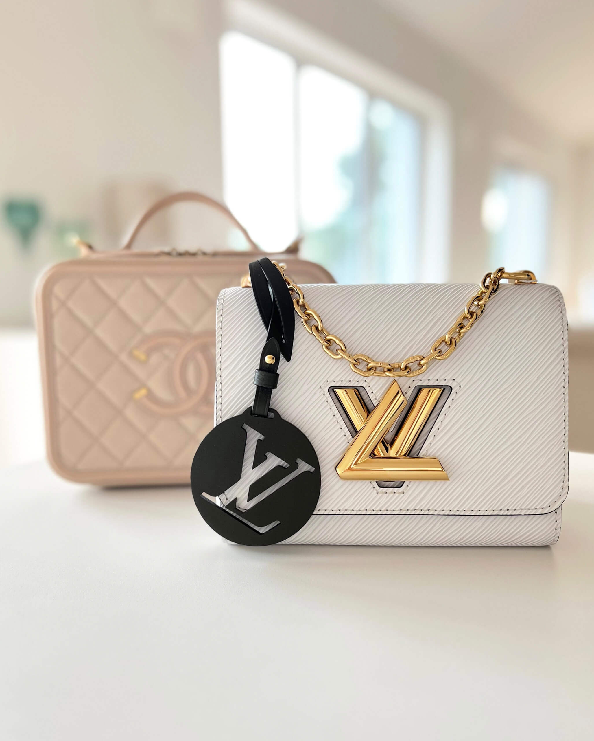 Louis Vuitton Twist Flap Bag and CHANEL Vanity Light Beige